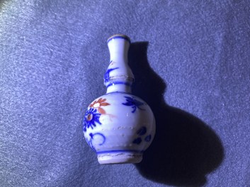 Five Chinese mostly blue and white vases, Kangxi